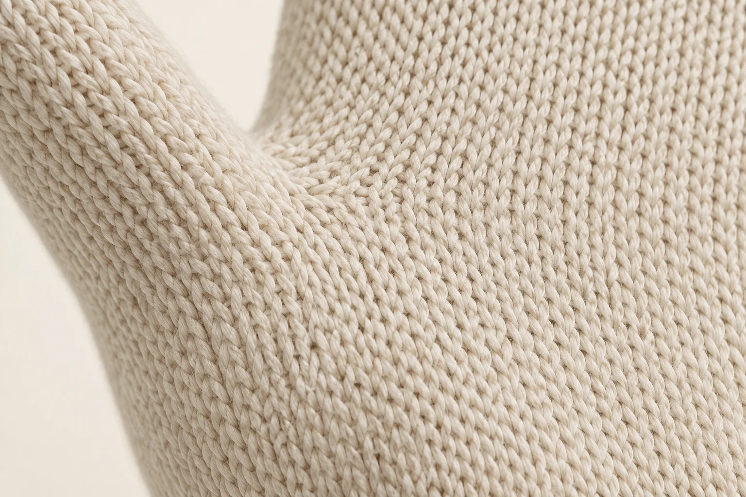 Cream plain-knit palm shaping around the thumb gusset.