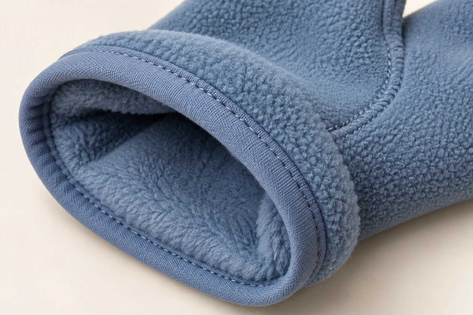 Fleece glove cuff interior and bound edge